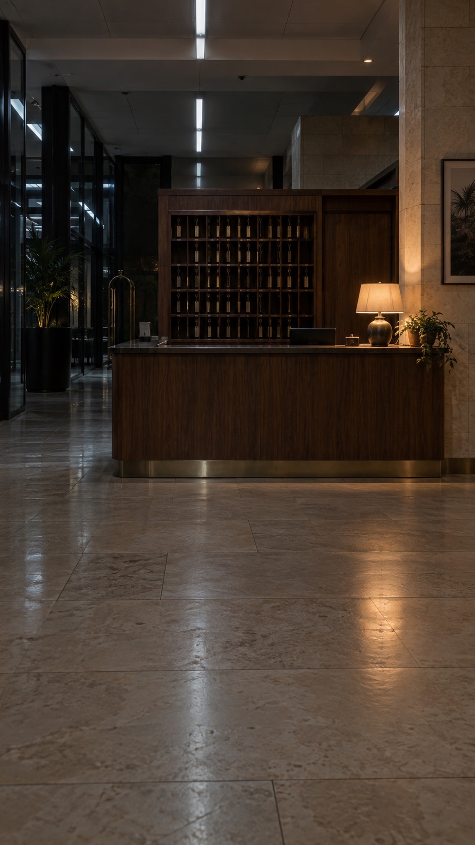 Night Desk: an empty hotel reception with a warm desk lamp