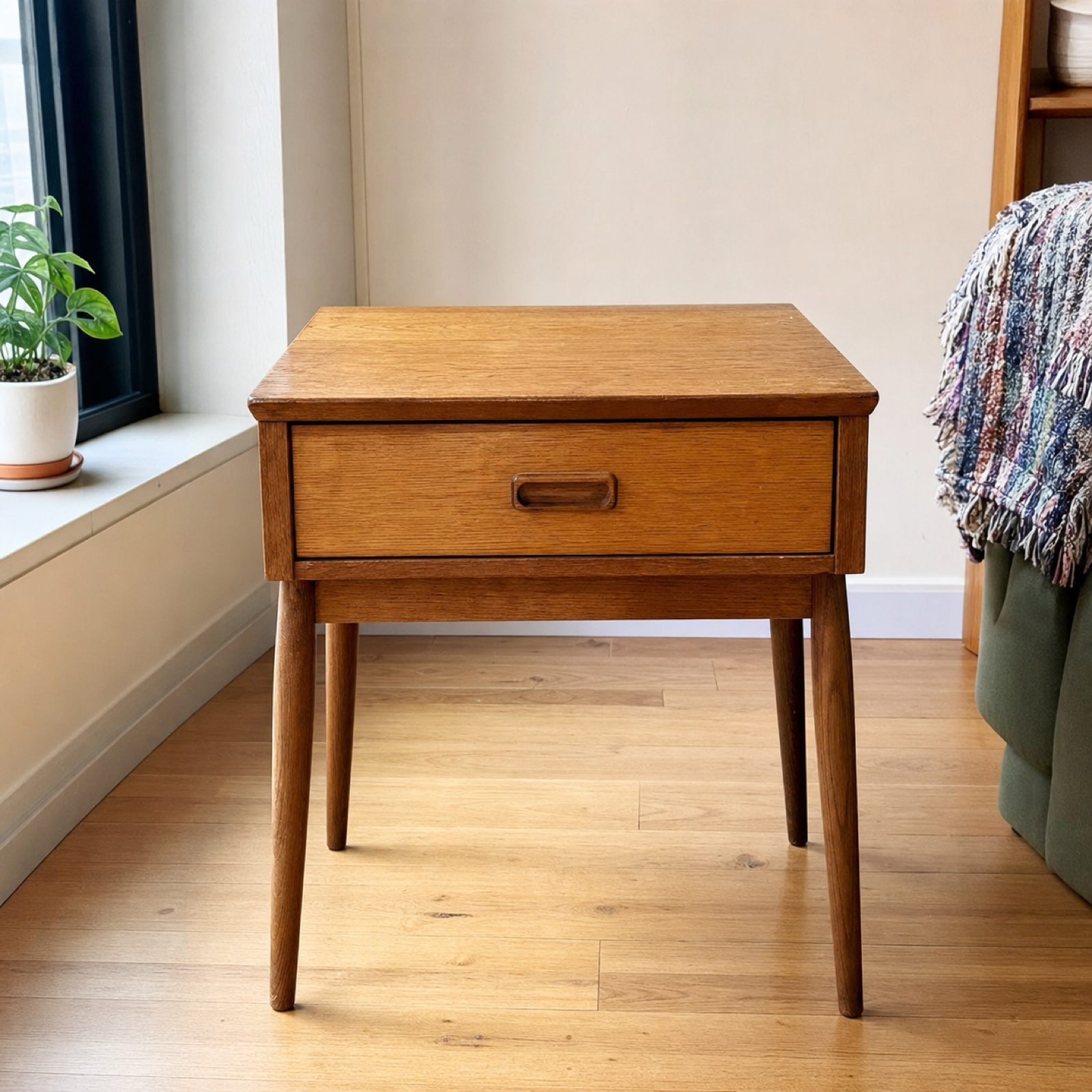 Oak side table photographed in a bright apartment