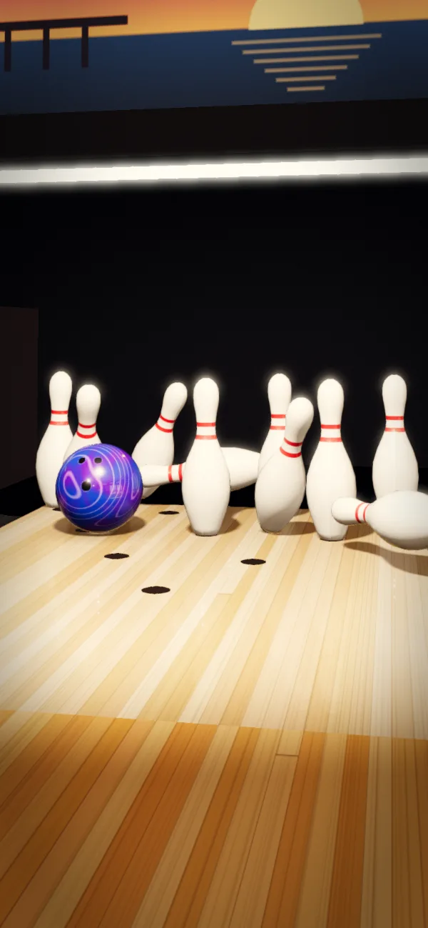 The ball crashing into the pocket, pins flying