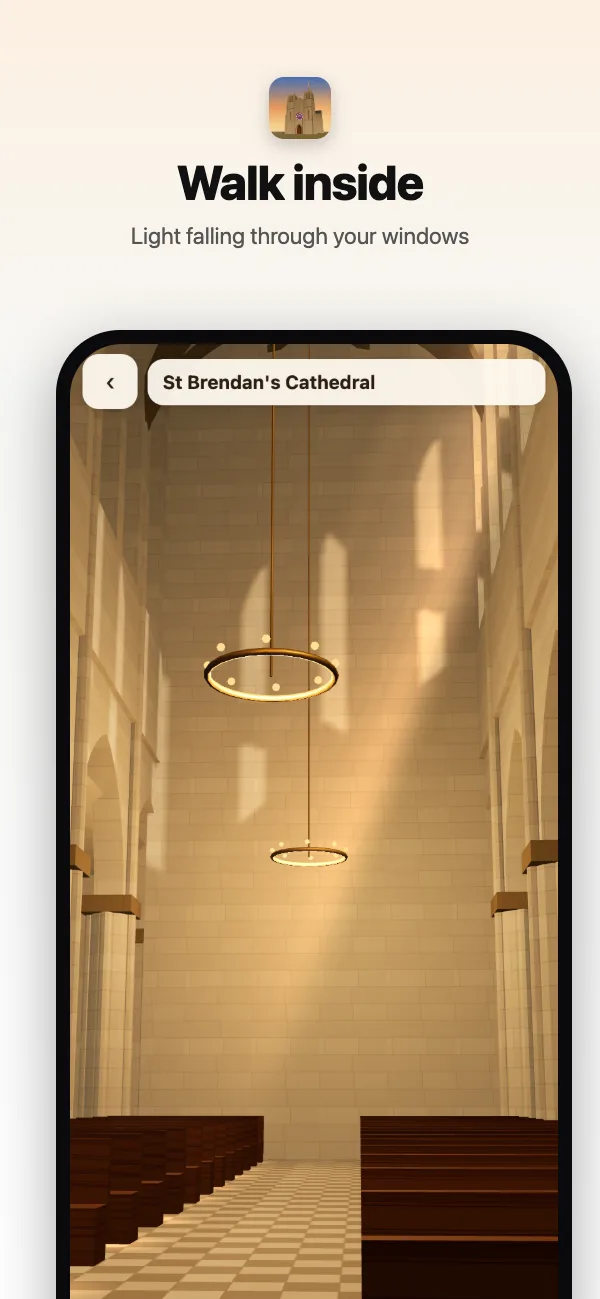 Inside St Brendan's: the nave, the pointed arcades, chandeliers and a shaft of coloured light